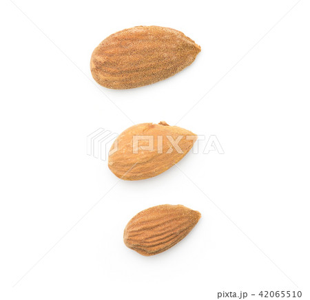 Raw almonds isolated on white Raw almonds isolated on white 42065510