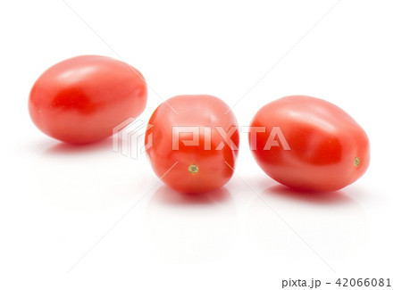 Red cherry tomatoes isolated on white Red cherry tomatoes isolated on white 42066081
