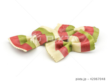 Colourful raw farfalle isolated on white Colourful raw farfalle isolated on white 42067048