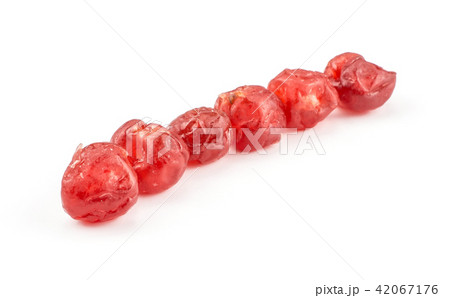 Dried red cherries isolated on white Dried red cherries isolated on white 42067176
