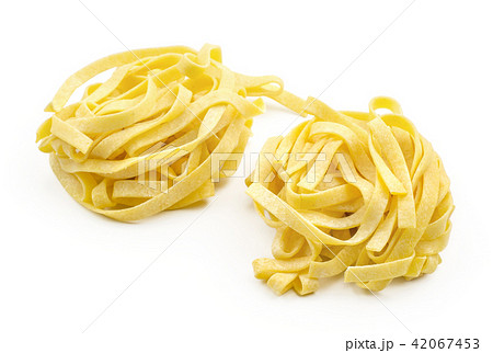 Raw fresh Fettuccine isolated on white Raw fresh Fettuccine isolated on white 42067453