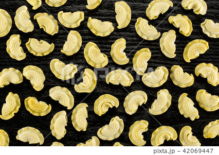 Fresh raw paste Creste di Gallo on black wood 42069447