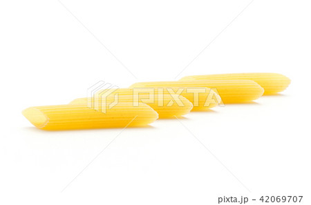Raw fresh penne isolated on white Raw fresh penne isolated on white 42069707