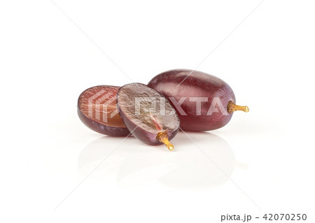 Raw fresh red globe grape isolated on white Raw fresh red globe grape isolated on white 42070250