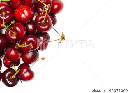 Fresh raw sweet red cherry isolated on white Fresh raw sweet red cherry isolated on white 42071000