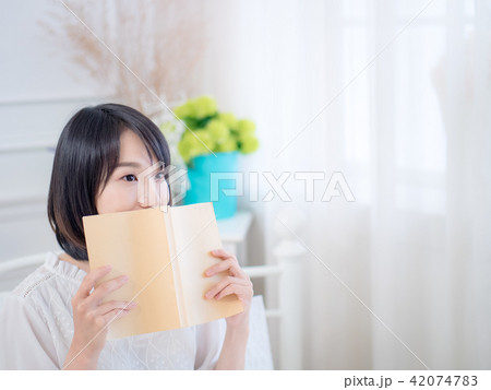 Portrait of a beautiful woman reading a book Portrait of a beautiful woman reading a book 42074783