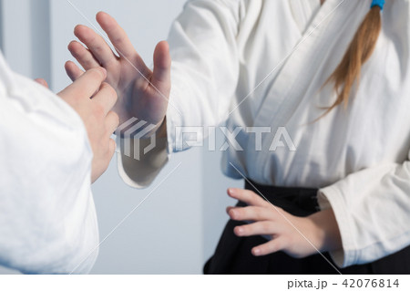 Two Girls Practice With Knife Tanto On Aikido Martial Arts Training On  White Background Stock Photo, Picture and Royalty Free Image. Image  51923963.