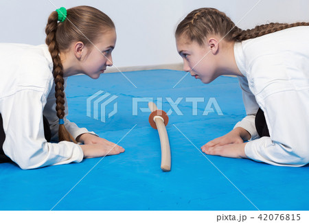 Two girls in hakama bow on Aikido training 42076815