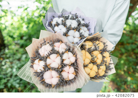 three beautiful and different bouquets lavender with cotton in woman hands . dried flowers lilac 42082075