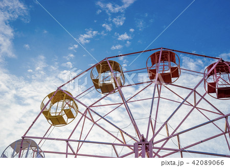 close up part of pastel ferris wheel on blue sky close up part of pastel ferris wheel on blue sky 42089066