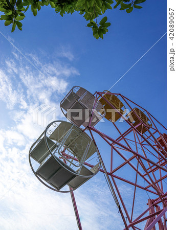 close up part of pastel ferris wheel on blue sky close up part of pastel ferris wheel on blue sky 42089067