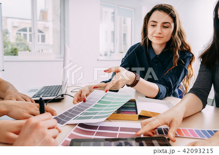 designers working with color samples 42093215