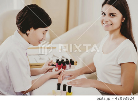 Happy Asian Professional Customer Doing Manicure. Happy Asian Professional Customer Doing Manicure. 42093924