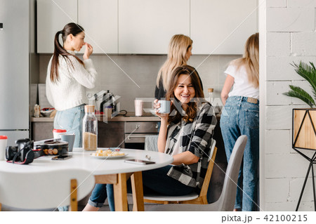 group of women in the kitchen group of women in the kitchen 42100215