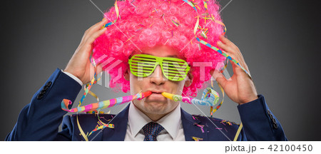 Funny businessman in pink wig Funny businessman in pink wig 42100450