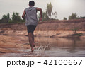 Black men runner are running at Riverside.black man doing workou 42100667