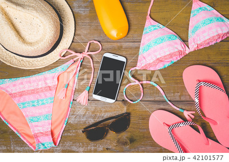 Summer accessories on an old wooden background 42101577