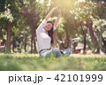 Beautiful Asian young woman sitting and relaxing  42101999