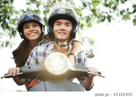 Couple riding motorbike 42102935