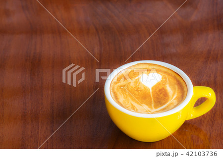Coffee cup on wood table. Coffee cup on wood table. 42103736