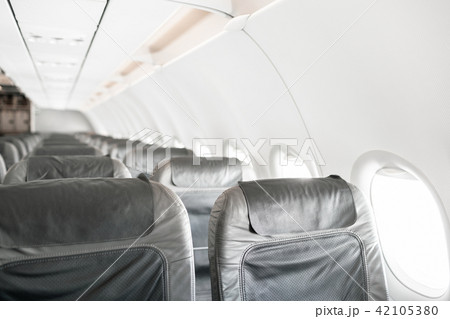 Empty airplane seats in the cabin. Modern Airplane seats in perspective. Transportation concept 42105380