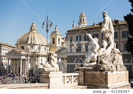 Sculptures and churches on Piazza del Popolo in Rome, Italy. 42108367