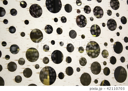 bright metal surface with round holes. abstract background 42110703