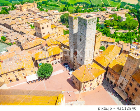 Aerial view of San Gimignano historical city centre with twin towers - Torri dei Salvucci, Tuscany 42112840