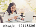 Asian women holding  credit card to payment  42113806