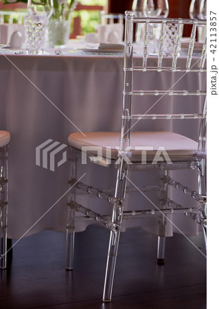 Transparent light chairs at the Banquet.Specific. Weightless transparent interior Transparent light chairs at the Banquet.Specific. Weightless transparent interior 42113857