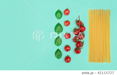 Italian pasta with tomatoes, grated parmesan and basil. 42115727