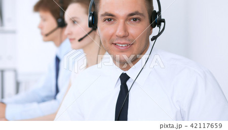 Young business man in headset. Call center Young business man in headset. Call center 42117659