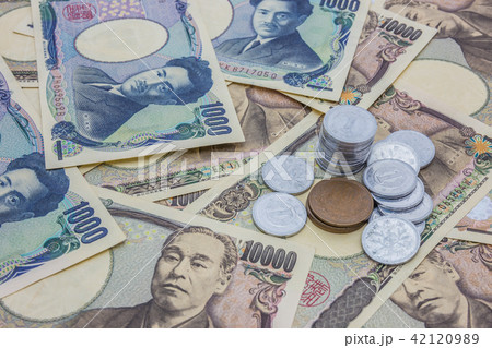 Closeup of Japanese yen banknotes and Japanese yen Closeup of Japanese yen banknotes and Japanese yen 42120989