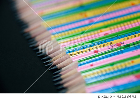 Row of colorful graphite sharpened pencil closeup Row of colorful graphite sharpened pencil closeup 42123443