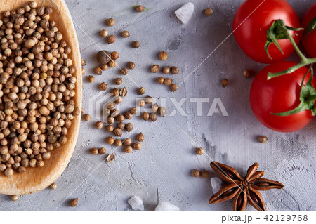 Coriander in wooden spoon with clipping path on white textured background, close-up, selective focus Coriander in wooden spoon with clipping path on white textured background, close-up, selective focus 42129768