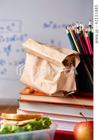 Preparing ham sandwiches for school lunchbox on wooden background, close up. Preparing ham sandwiches for school lunchbox on wooden background, close up. 42131885