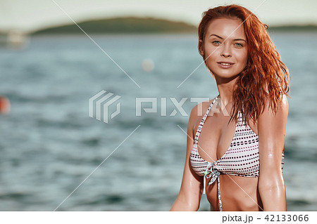 Pretty slim girl at sea beach Pretty slim girl at sea beach 42133066