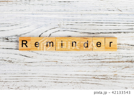 REMINDER word made with wooden blocks concept 42133543