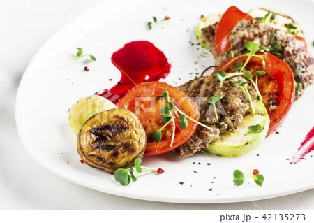 Grilled meat with vegetables, zucchini, mushrooms Grilled meat with vegetables, zucchini, mushrooms 42135273