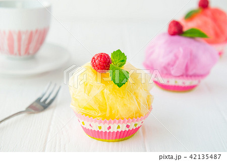 Concept of artificial, plastic food. GMO, E numbers and genetically modified sweets. Use of Concept of artificial, plastic food. GMO, E numbers and genetically modified sweets. Use of 42135487