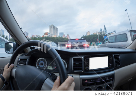 Driving car on city street Driving car on city street 42139071