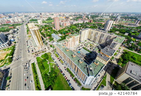 Aerial city view with crossroads and roads, houses buildings. Copter shot. Panoramic image. 42140784