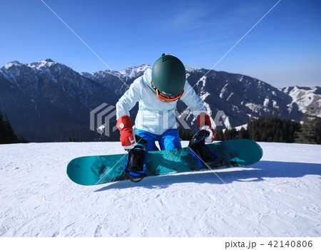 young woman snowboarder ready for snowboarding young woman snowboarder ready for snowboarding 42140806