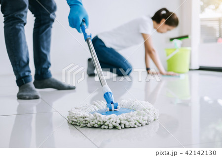 Housekeeping and cleaning concept, Young couple in blue rubber g 42142130