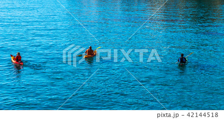 Senior kayaker on a kayak by the sea Senior kayaker on a kayak by the sea 42144518
