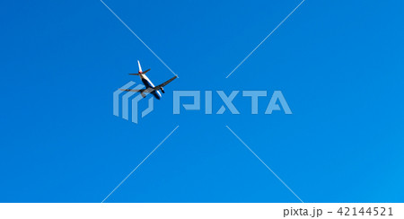 Passenger plane flying in the blue sky Passenger plane flying in the blue sky 42144521