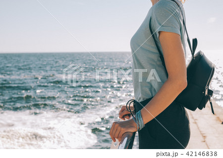 Young woman tourist standing near the sea 42146838