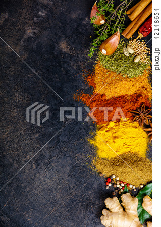 Spices and herbs on a dark background Spices and herbs on a dark background 42148654