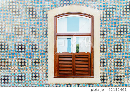 Wooden Window On Blue Tile Wall In Lisbon 42152461