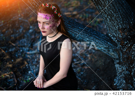 A young beautiful woman with a violet shine  42153716